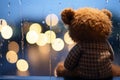 A forlorn teddy bear, rain kissed window, cocooned in bokeh warmth