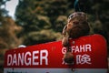 Forlorn Toy on Danger Sign Royalty Free Stock Photo