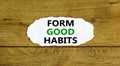 Form good habits symbol. Words `Form good habits` on white paper. Beautiful wooden background. Business, psychology and form goo Royalty Free Stock Photo