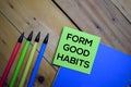 Form Good Habits write on a sticky note isolated on wooden background Royalty Free Stock Photo