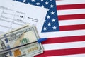 Form 1099-misc Miscellaneous income and blue pen with dollar bills lies on United States flag. Internal revenue service tax form