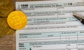 Form 1040 Simplified with bitcoin coins for reporting currency gains