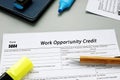 Form 5884 Work Opportunity Credit sign on the piece of paper