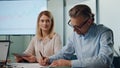 Formal businessman signing contract indoors closeup. Partners shaking hands deal