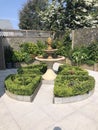 Formal courtyard garden with fountain. Royalty Free Stock Photo