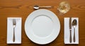 Formal Dining Table Setting with White Plate Cutlery and Drink image photo Royalty Free Stock Photo