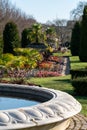 Formal flower gardens in Regent`s Park, London UK, photographed in springtime with water fountain in foreground. Royalty Free Stock Photo
