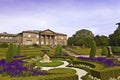 Formal garden and a mansion house. Royalty Free Stock Photo