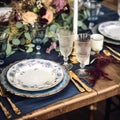 Formal holiday tablescape with blue decor, dinner table setting, table scape with elegant tableware and dinnerware for Royalty Free Stock Photo