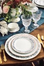 Formal holiday tablescape with blue decor, dinner table setting, table scape with elegant tableware and dinnerware for Royalty Free Stock Photo