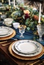 Formal holiday tablescape with blue decor, dinner table setting, table scape with elegant tableware and dinnerware for Royalty Free Stock Photo