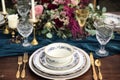 Formal holiday tablescape with blue decor, dinner table setting, table scape with elegant tableware and dinnerware for Royalty Free Stock Photo