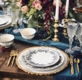 Formal holiday tablescape with blue decor, dinner table setting, table scape with elegant tableware and dinnerware for Royalty Free Stock Photo