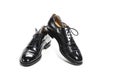 Formal Male Stylish Black Polished Oxford Leather Laced Shoes Placed Together Over White