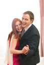 Formally dressed happy couple having fun dancing Royalty Free Stock Photo