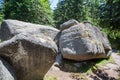 Formation of a larger rock, igneous rocks, granodiorite, located in the middle of a coniferous forest, mountain Kopaonik, Serbia. Royalty Free Stock Photo