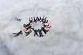 Formation skydiving.A big group of skydivers is in the sky above white clouds.