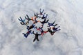 Formation skydiving.A big group of skydivers is in the sky above white clouds. Royalty Free Stock Photo