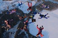 Formation skydiving. Skydivers are doing a figure in the sky.