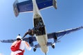 Formation skydiving. Skydivers are falling in the sky.