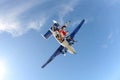 Formation skydiving. Skydivers are falling without suits.