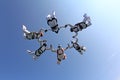 Formation skydiving. Skydivers have done a circle in the sky. Royalty Free Stock Photo