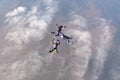 Formation skydiving. Three skydivers are in the sky. Royalty Free Stock Photo