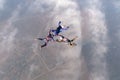 Formation skydiving. Three skydivers are in the sky. Royalty Free Stock Photo