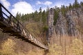 Wooden footbridge leading to beautiful rock formation