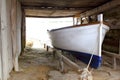 Formentera boat stranded on wooden rails Royalty Free Stock Photo