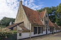 The former almshouse, now a restaurant, next to the old Nicholas Church on the Kerkplein on the island of Vlieland Royalty Free Stock Photo