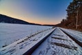 Winter on the rail tracks in Devils Lake State Park at sunset Royalty Free Stock Photo