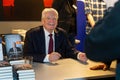 the former Federal President Joachim Gauck signs books in Wilhelmshaven