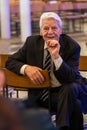 Former Federal President Joachim Gauck sits sideways on a chair while talking