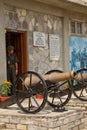 Former Gurkha soldier with cannon of the Memorial Museum, Pokhar