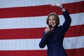 Former HP exec Carly Fiorina waves in front of US flag