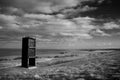 Former mining shaft cage turned into a memorial monument for Easington Coal Mine stands in a field overlooking the coastline