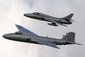 Former Royal Air Force English Electric Canberra photographic reconnaissance aircraft flying in formation with a Hawker Hunter. Royalty Free Stock Photo