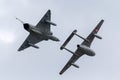 Former Swiss Air Force Dassault Mirage III fighter aircraft J-2012 HB-RDF flying in formation with a de Havilland Vampire