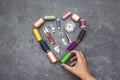 Forming a heart shape with a collection of thread spools and sewing tools Royalty Free Stock Photo