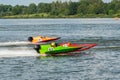 Formula boats go fast along the lake Royalty Free Stock Photo