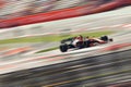 Formula One race. Racing car speed driving on track. Motion blur from long exposure Royalty Free Stock Photo