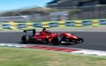 Formula racing car speed action on asphalt racetrack blurred motion background