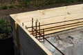 Formwork for the foundation of the house. Closeup of house foundation made from concrete shuttering blocks filled with mortar and