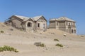 forsaken buildings on sand at mining ghost town in desert, Kolmanskop, Namibia