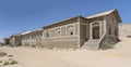 forsaken hospital buildings on sand at mining ghost town in desert, Kolmanskop, Namibia