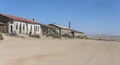 forsaken service buildings on sand at mining ghost town in desert, Kolmanskop, Namibia