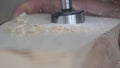 Forstner drill with wood filings slow motion macro footage. Joiner's workshop and woodworking