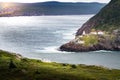 Fort Amherst Lighthouse historic site photograph taken from Signal hill with tourists overlooking a cliff near St. John\'s