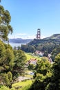 Fort baker, tall trees on the left and the Golden Gate Bridge towers poking up in the distance